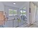 Bright playroom area with natural light, play equipment, and sliding glass doors to a patio at 11336 Callaway Pond Dr, Riverview, FL 33579