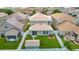 Aerial view of a fenced backyard with lawn, storage shed, and the home's roof at 12121 Tree Haven Ave, Gibsonton, FL 33534