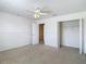 Bedroom with ceiling fan, closet and ensuite bathroom at 12121 Tree Haven Ave, Gibsonton, FL 33534