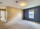 Bedroom with neutral carpet, closet, and a window that provides natural light at 12121 Tree Haven Ave, Gibsonton, FL 33534