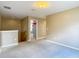 Upper-level bonus room featuring neutral carpet and ample natural light at 12121 Tree Haven Ave, Gibsonton, FL 33534