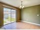 Dining area features a sliding glass door leading to the fenced backyard at 12121 Tree Haven Ave, Gibsonton, FL 33534
