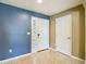 Home entryway with tile flooring, neutral paint and decorative door accents at 12121 Tree Haven Ave, Gibsonton, FL 33534