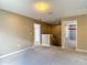 Bright hallway with neutral walls, carpet flooring, and doorways leading to various rooms upstairs at 12121 Tree Haven Ave, Gibsonton, FL 33534