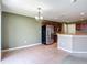 Eat-in kitchen features stainless steel appliances, wooden cabinetry, and tile flooring at 12121 Tree Haven Ave, Gibsonton, FL 33534