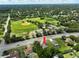 An aerial shot of the property location, close to a baseball field, green space, and on a quiet street at 12277 Spring Hill Dr, Spring Hill, FL 34609