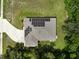Aerial view of a house featuring solar panels and a long driveway at 12277 Spring Hill Dr, Spring Hill, FL 34609