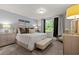 Inviting bedroom features soft lighting, neutral tones, and a comfortable bed, creating a relaxing atmosphere at 12277 Spring Hill Dr, Spring Hill, FL 34609