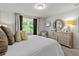 Well-lit bedroom with a dresser and TV, creating a comfortable and inviting space at 12277 Spring Hill Dr, Spring Hill, FL 34609