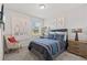 Comfortable bedroom featuring a bed, window with blinds, and a charming decor at 12277 Spring Hill Dr, Spring Hill, FL 34609