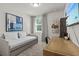 Bedroom featuring a cozy daybed, natural light, and a modern desk space at 12277 Spring Hill Dr, Spring Hill, FL 34609