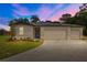 Charming single-Gathering home featuring a three-car garage, solar panels, and a well-manicured lawn at 12277 Spring Hill Dr, Spring Hill, FL 34609