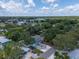 Aerial view of the property highlighting the home, landscaping, and surrounding neighborhood at 132 Pennsylvania Ave, Palm Harbor, FL 34683