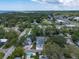 Expansive aerial view captures the neighborhood and house, showing its location in the community at 132 Pennsylvania Ave, Palm Harbor, FL 34683