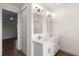 Bathroom with double vanity, stylish mirrors, and modern lighting fixtures, adding elegance and functionality at 132 Pennsylvania Ave, Palm Harbor, FL 34683
