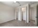 Bright bedroom featuring plush carpet, a ceiling fan, and double closets for ample storage space at 132 Pennsylvania Ave, Palm Harbor, FL 34683