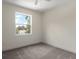 Bedroom with carpet flooring, a ceiling fan, and a window offering natural light and outdoor views at 132 Pennsylvania Ave, Palm Harbor, FL 34683