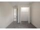 Spacious bedroom featuring carpet and closet for storage, and view to the rest of the house at 132 Pennsylvania Ave, Palm Harbor, FL 34683