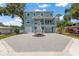 Beautiful two-story home featuring a charming front porch and a spacious driveway at 132 Pennsylvania Ave, Palm Harbor, FL 34683