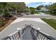 Front exterior and steps with decorative stone, flowering plants, and black metal railings at 132 Pennsylvania Ave, Palm Harbor, FL 34683