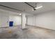 Spacious two-car garage featuring a concrete floor, overhead lighting, and a door to the interior of the home at 132 Pennsylvania Ave, Palm Harbor, FL 34683