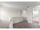 Upstairs hallway featuring neutral carpet and a linen closet, leading to additional rooms in the home at 132 Pennsylvania Ave, Palm Harbor, FL 34683