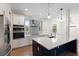 Modern kitchen featuring stainless steel appliances, countertops, and a stylish backsplash at 132 Pennsylvania Ave, Palm Harbor, FL 34683