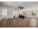 An expansive living room transitions into a modern kitchen, perfect for entertaining guests at 132 Pennsylvania Ave, Palm Harbor, FL 34683