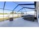 Screened-in patio with a hot tub and fire pit area and private yard at 1332 Ocean Spray Dr, Ruskin, FL 33570