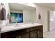 Bathroom featuring double sinks, a large mirror, and modern fixtures at 1332 Ocean Spray Dr, Ruskin, FL 33570