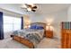 Comfortable bedroom featuring a ceiling fan, window, and furnishings at 1332 Ocean Spray Dr, Ruskin, FL 33570