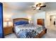Cozy bedroom featuring a ceiling fan, lamps, and comfortable furnishings at 1332 Ocean Spray Dr, Ruskin, FL 33570