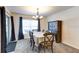 Traditional dining room with decorative light fixture, complete with table and chairs at 1332 Ocean Spray Dr, Ruskin, FL 33570
