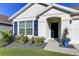 Charming single-Gathering home with well-manicured lawn and blue door at 1332 Ocean Spray Dr, Ruskin, FL 33570