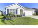 Charming single-Gathering home with well-manicured lawn and two-car garage at 1332 Ocean Spray Dr, Ruskin, FL 33570