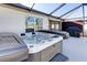 Outdoor hot tub on a covered patio, perfect for relaxing at 1332 Ocean Spray Dr, Ruskin, FL 33570