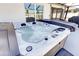 Luxurious hot tub with jets and controls on a screened patio at 1332 Ocean Spray Dr, Ruskin, FL 33570