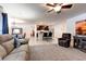 Open-concept living space flowing into a modern kitchen with a center island at 1332 Ocean Spray Dr, Ruskin, FL 33570