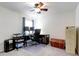 A functional office space featuring a ceiling fan, a desk with computer setup, and filing cabinet at 1332 Ocean Spray Dr, Ruskin, FL 33570