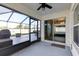 Relaxing screened patio with ceiling fan and sliding glass doors leading inside at 1332 Ocean Spray Dr, Ruskin, FL 33570