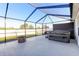 Enclosed patio featuring a hot tub and a brick fire pit at 1332 Ocean Spray Dr, Ruskin, FL 33570