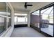 Enclosed patio featuring sliding glass doors and a ceiling fan at 1332 Ocean Spray Dr, Ruskin, FL 33570