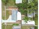 A bird's-eye view of a home with a fenced yard and mature trees at 1510 W Powhatan Ave, Tampa, FL 33603