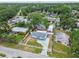 A home with a picket fence and mature trees in a quiet neighborhood at 1510 W Powhatan Ave, Tampa, FL 33603