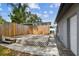 Private fenced backyard with open deck and mature trees at 1510 W Powhatan Ave, Tampa, FL 33603