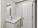 Bright bathroom featuring a new vanity with marble-style countertop and ample storage at 1510 W Powhatan Ave, Tampa, FL 33603