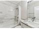Bathroom featuring tiled shower-tub combo and marble-look vanity at 1510 W Powhatan Ave, Tampa, FL 33603