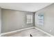 This light and airy bedroom has updated flooring, neutral paint, and windows for natural light at 1510 W Powhatan Ave, Tampa, FL 33603