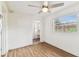Bright bedroom featuring hardwood floors, ceiling fan, and window allowing natural light at 1510 W Powhatan Ave, Tampa, FL 33603