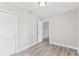 Comfortable bedroom featuring wood-look flooring and a double door closet at 1510 W Powhatan Ave, Tampa, FL 33603